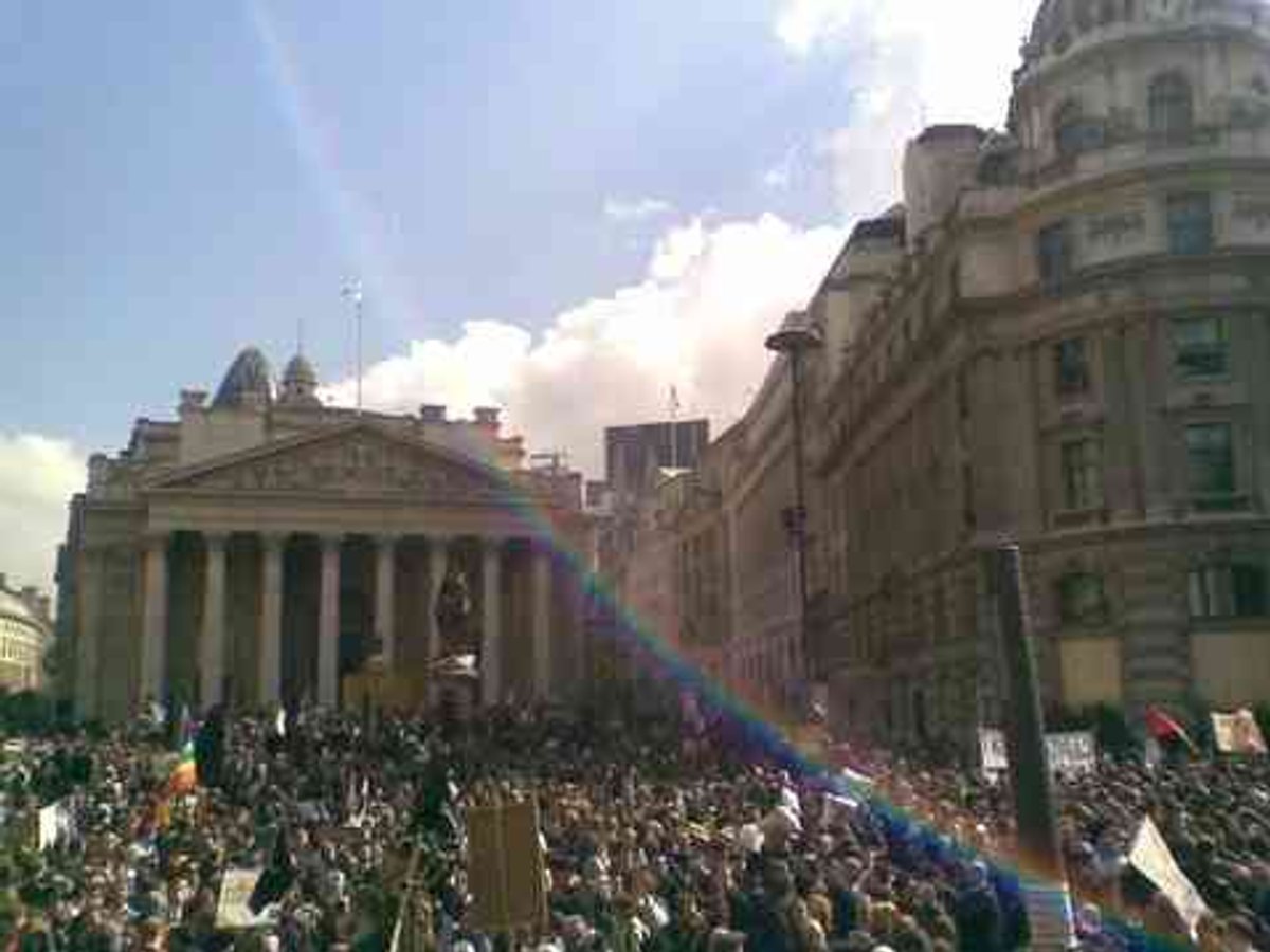 A crowd filling the street outside the Bank of England in London